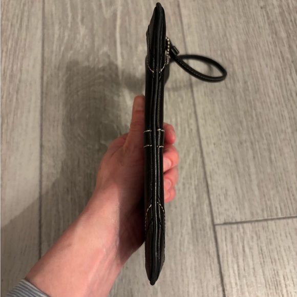 Coach wristlet in black leather. Hangtag present. EUC. - Picture 5 of 11